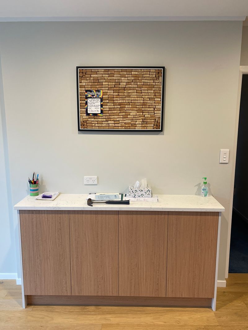 Installed wine cork notice board above a bench, where random bits of paper tend to collect